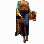 Statement piece kimono robe in long floor length with wide long sleeves worn over jeans and t-shirt