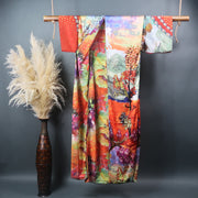 hanging floor length kimono hung on bamboo rod in dancing colors showing a summery garden inner flower printed pattern is shown on inner lining