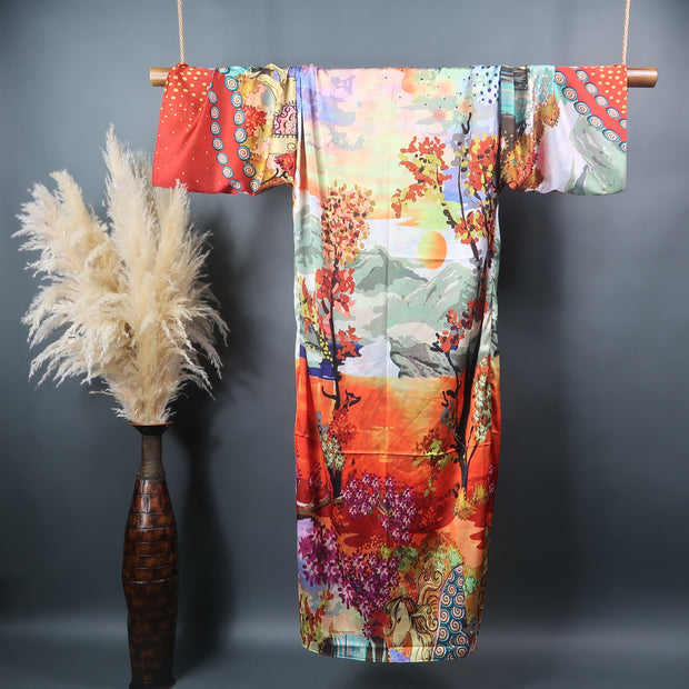 rear view of long length kimono with printed sunset and trees in red  orange and blue tones