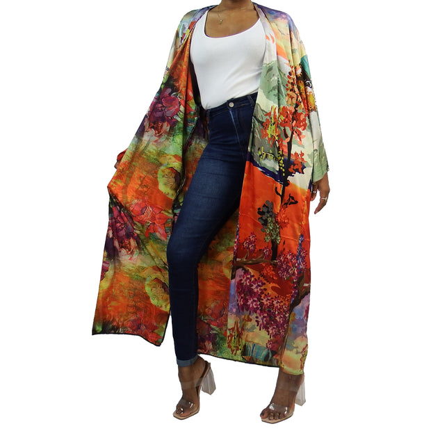 Long floor length kimono jackect worn over dark blue jeans and white t-shirt