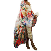 woam wearing a beautiful flower printed kimono robe blowing in the wind