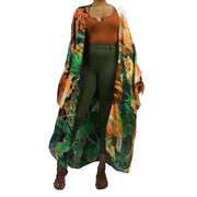 Kimono Fashion robe in green print worn over jeans and orange t-shirt