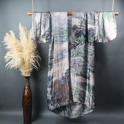 Japanese mountains on kimono hung on bamboo rod