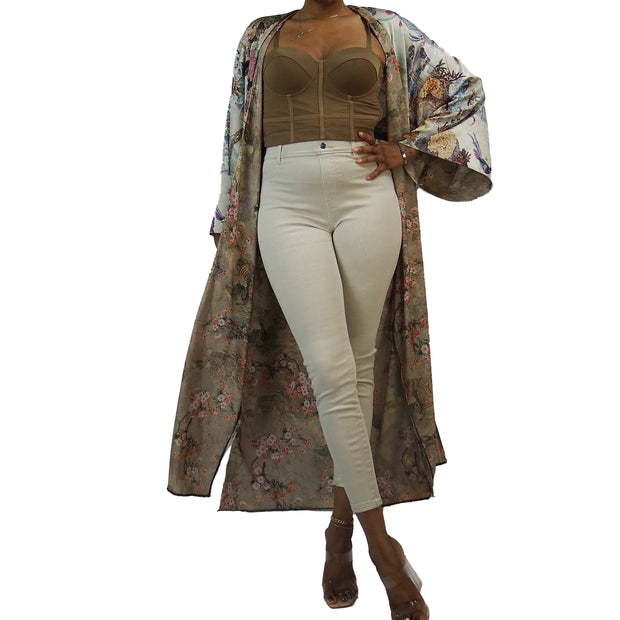 Nude taupe and tan kimono cardigan with muted flower pattern worn over beige clothing