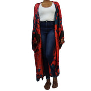 long red and blue kimono duster worn over casual clothing