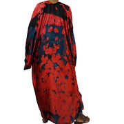 Lon kimono robe shown form the back showing blue background and read flower petals pattern