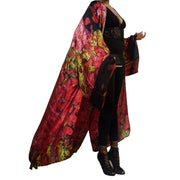 lightweight kimono robe blowing in the breeze in shades of pink gold and black